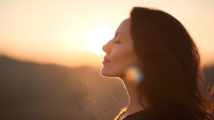Serene woman silhouetted against a warm sunset horizon contemplative lifestyle photography