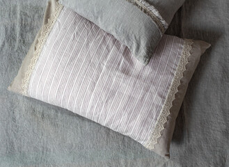 Linen textile pillowcases for a bed in a room