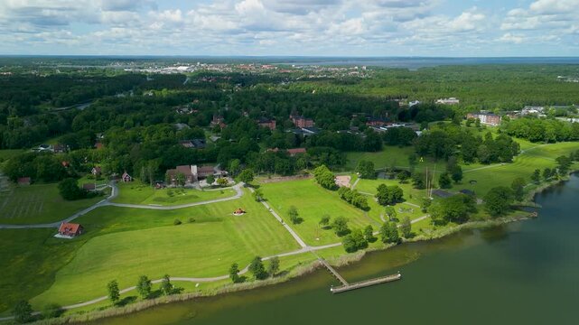 Drone footage of historic Restad Gard campus buildings and Holzhausens park landscape by Gota riverbank