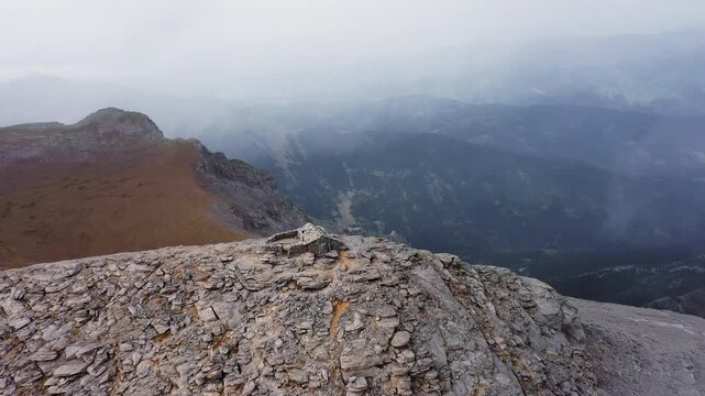 Panoramic drone shot flying over the Greek Orthodox Chapel of the Prophet Elias on the Profitis Ilias peak of Mount Olympus, Greece