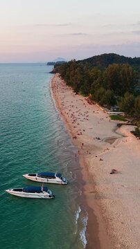 Stunning aerial drone view of Long Beach on Koh Lanta Island Thailand, showcasing its serene natural beauty atmospheric lighting, Sunset