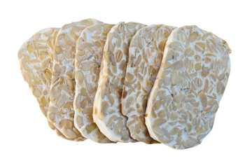 sliced raw tempeh. these organic tempeh slices showcase the distinct texture of fermented soybeans. It is an essential ingredient in plant-based diets, offering a rich source of probiotics and fiber