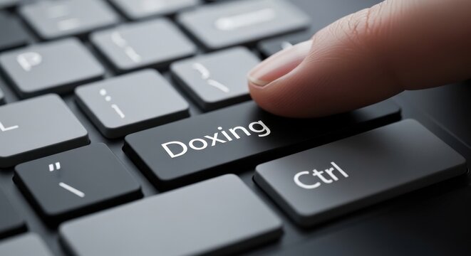 Macro Close-up of a Finger Pressing a Black "Doxing" Keyboard Key for Cybersecurity and Data Privacy Awareness