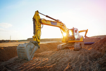 Excavator earthworks on construction site. Sewer line repair. Excavator groundwork water line repair. Backhoe earthmoving. Earthmover, excavator dig trench for replacement sewage. Water line repair. © MaxSafaniuk