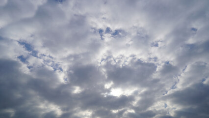 Fototapeta premium Dramatic Sun Rays Breaking Through Dark Storm Clouds