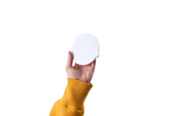 hand holding white round object on white background