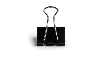 Black metal binder clips on white background. High quality photo