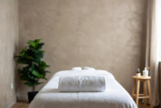 Serene Spa Interior with Massage Table, Soft Daylight and Elegant Natural Decor
