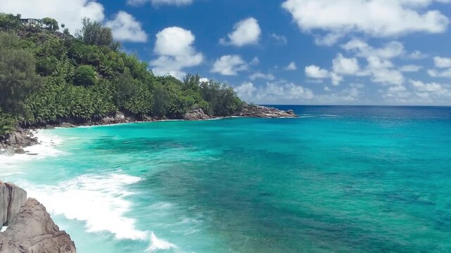 Vacation travel holidays and recreation on beach concept. Tropical beach with sea and palm taken from drone. Praslin island, Seychelles. Slow motion