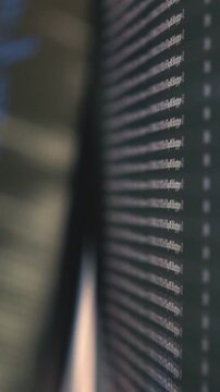 Blurred computer screen displaying terminal output with lines of code and system logs on a dark interface.