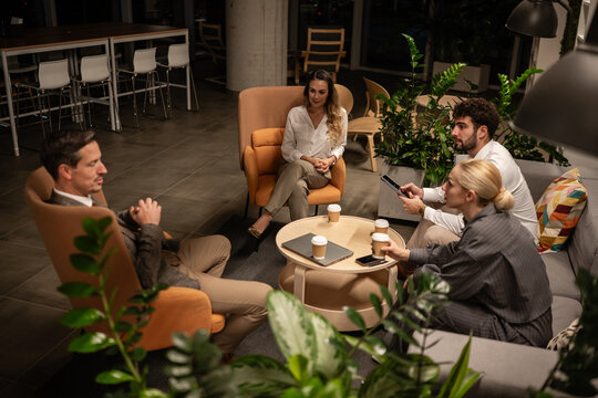 Business colleagues meeting in modern office lounge area
