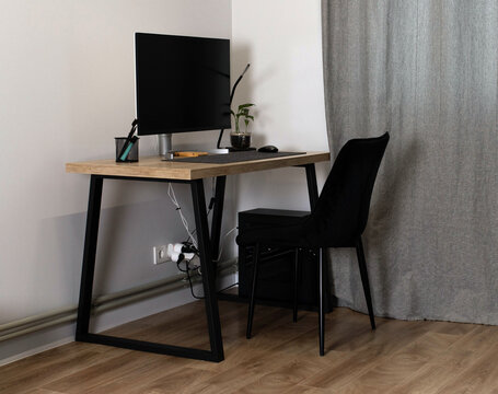 Full view of a modern minimalist home office setup. Clean and productive workspace interior. Freelance life. Workplace organization