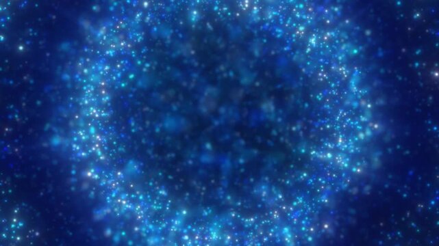 Blue sparkling bokeh particles forming a dreamy cosmic background with soft glow and depth