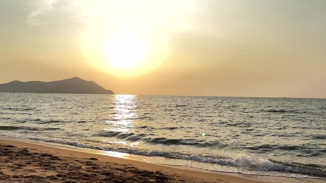 The sunset atmosphere at Bang Ha Rae Beach, Chonburi Province, Thailand.