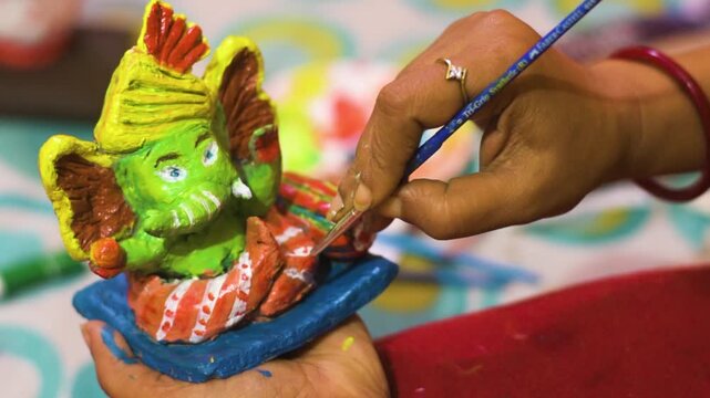 Artist Hand Painting Handmade Lord Ganesha Idol for Ganesh Chaturthi Festival