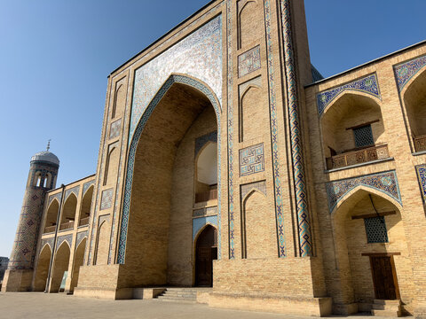 Kukeldash Madrasah entrance in Tashkent, Uzbekistan. Historic Kukeldash Islamic educational institution, ornate tiled portal and minaret, cultural landmark and architectural heritage. 