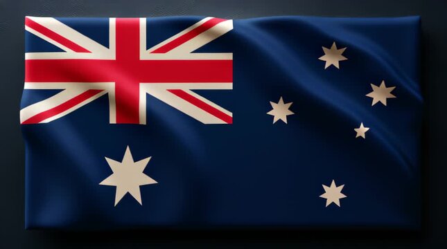 Australia flag waving with stars visible on a blue background during bright daylight in an outdoor setting
