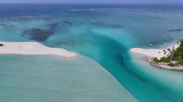 Maldives beautiful aerial view of a crystal clear turquoise water channel separating a lush tropical island and a white sandbank. Amazing travel destination, Mathiveri.