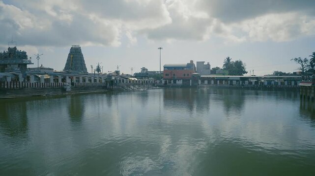 Historic Tamil Nadu Temple Complex with Gopuram and Holy Tank