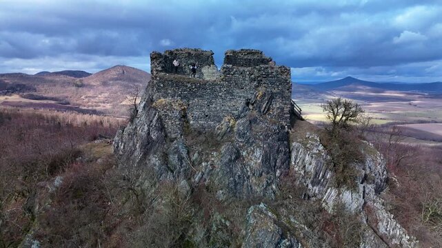 Vertical drone aerial around medieval stone castle ruins