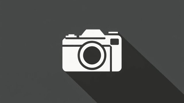 Simple white camera icon with long shadow on gray background