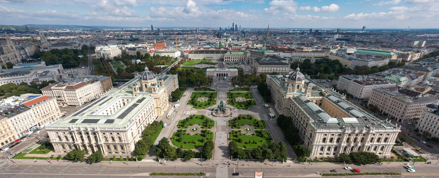 Aerial view of Maria Theresienplatz and Heldenplatz's gardens juxtapose the grandeur of the Natural and History Museums against Vienna's skyline, Vienna, Austria.