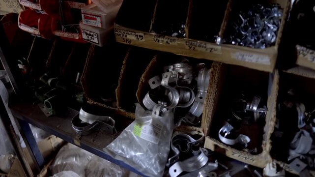 Industrial metal parts stored in a dim workshop, vintage feel, organized