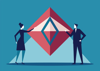 Fototapeta premium A man and a woman in business suits uncover a large abstract diamond-shaped symbol on a blue background.
