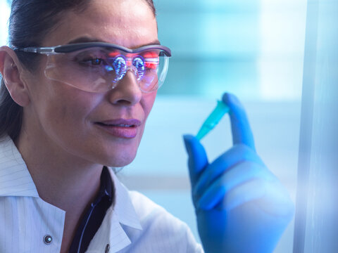 Scientist in lab testing DNA sample for neurology and brain research