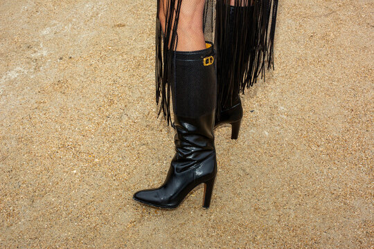 Paris 2025, A woman wears Christian Dior boots during Paris fashion week