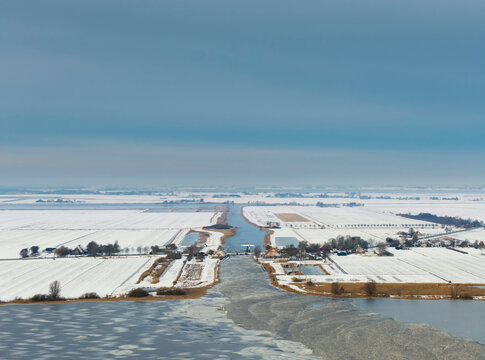 Winter aerial view of canal and lake in Frisian lake district Netherlands