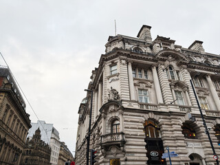 Naklejka premium Ornate 19th century building on King Street in Manchester, a grand stone facade