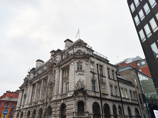 Obraz premium Historic white stone building in Manchester city centre with ornate architecture and arches
