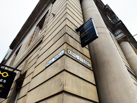 Manchester street corner building on Pall Mall and King Street with historic architecture signage