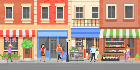 Colorful storefronts line a busy city street with pedestrians © Pabitra