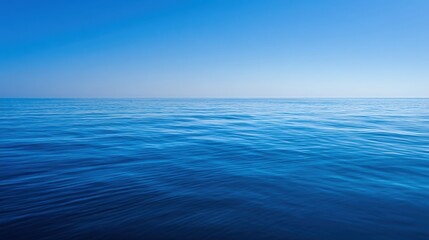 Obraz premium The Ocean Horizon Stretching Under a Clear Blue Sky in a Calm Serene Seascape