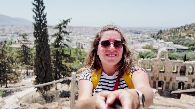 Excited Tourist Showing View of an Ancient Theatre, Athens, Greece