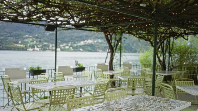Lakeside terrace with shallow bokeh and defocused lake view cafe; background backplate copyspace calm.
