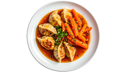 Dumplings and glazed carrots on a white plate, aerial view