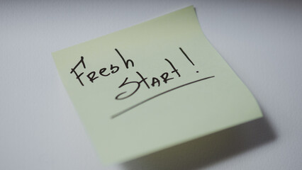 Fresh Start handwritten note on sticky note minimal background