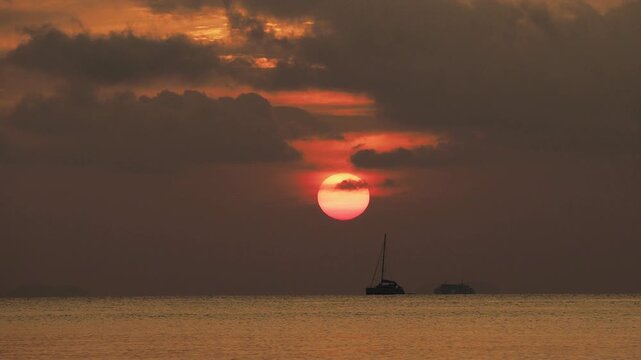 Dramatic red sunset over Lipa Noi beach. Koh Samui, Thailand.