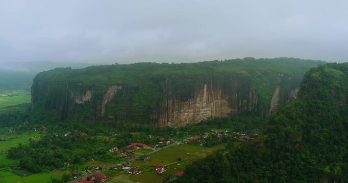 Aerial Cinematic View of Remote Foggy Mountain Cliff Environment