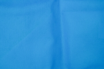 Abstract pattern and texture background of wrinkled blue eco bag surface. Ecology and environmental concept. Copy space for text. For graphic design, 3D rendering and banners