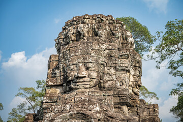 Fototapeta premium Siem Reap, Cambodia - Buddha head on tower of Bayon Temple in Angkor Thom