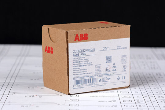 ABB equipment in cardboard packaging on an electronic digram during the assembly of the electrical control panel.