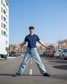 Confident Young Man standind in Front of Modern Apartment Building &ndash; Concept of Home Buying and Real Estate Investment