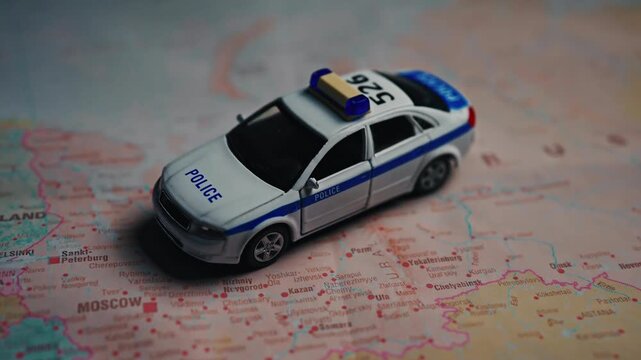 Police car model on map of Russia.