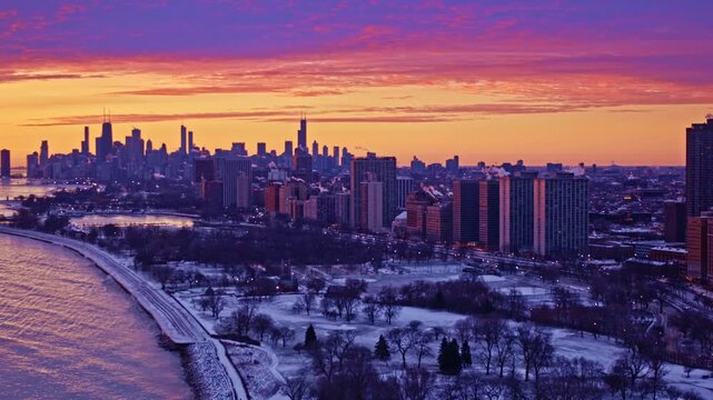 Dramatic skyline glide with expansive lake backdrop