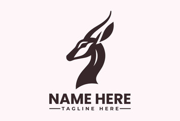 Obraz premium A minimalist logo design featuring a stylized antelope head in black silhouette on a light pink background with placeholder text for a company name and tagline.