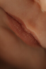 Fototapeta premium close-up portrait of a baby, macro photography, baby's lips close-up